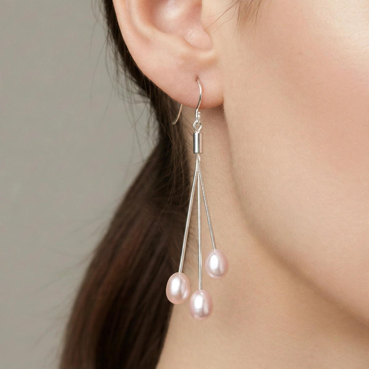 Pink trilogie freshwater pearl drop earring worn on ear — Golden Rose Arts